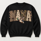MAMA patchwork-style lettering, bows and flying mallard on black sweatshirt front, flat lay showing complete print