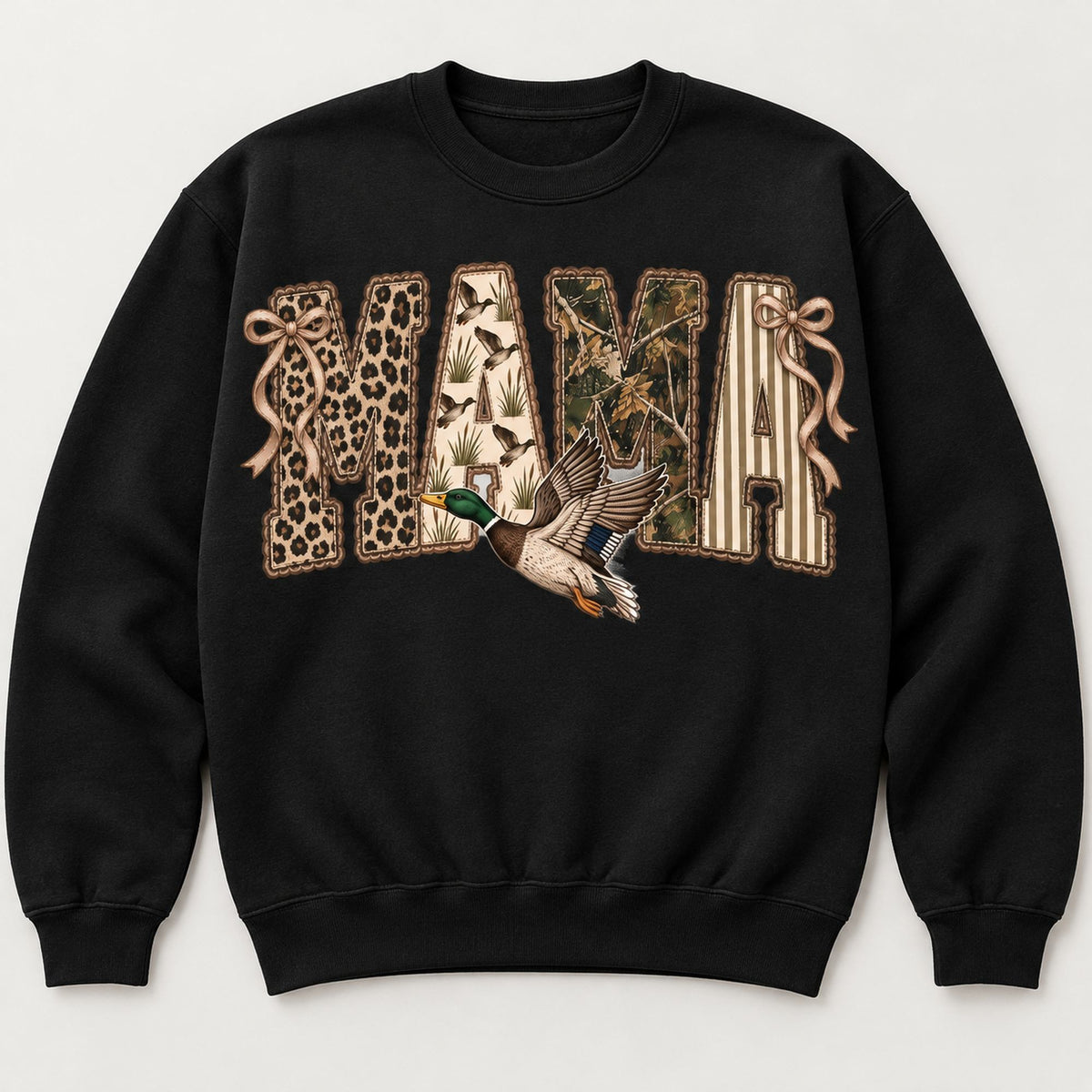 MAMA patchwork-style lettering, bows and flying mallard on black sweatshirt front, flat lay showing complete print