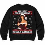 All I Want for Christmas Is Ella Langley black sweatshirt flat lay, showing the Santa-hat portrait and snowflake front graphic
