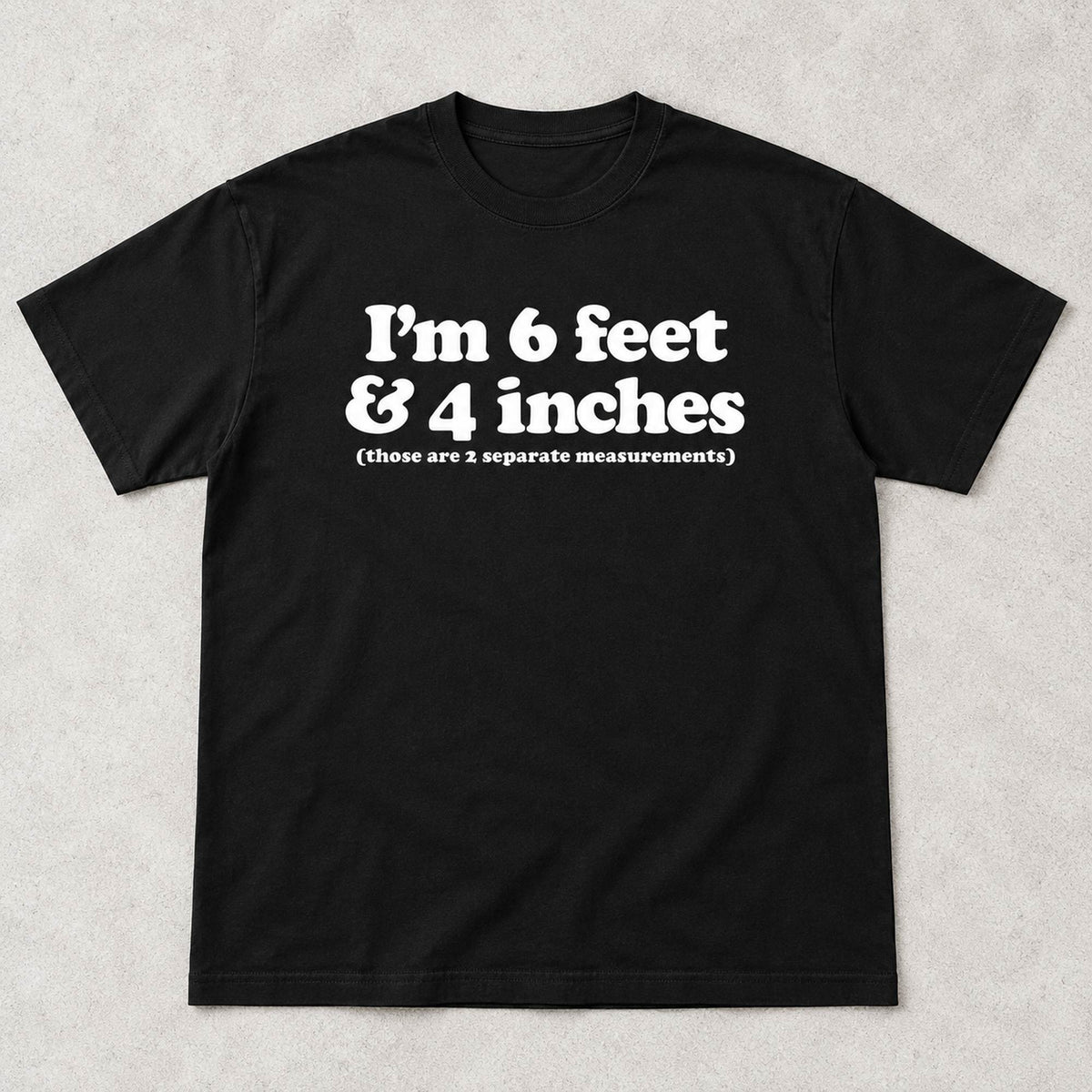 Black graphic tee front flat lay with I'm 6 Feet And 4 Inches design
