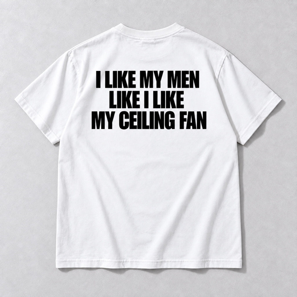 I Like My Men Like I Like My Ceiling Fan white tee back flat lay with black three-line slogan
