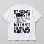 White marriage humor graphic T-shirt laid flat from the back with black lettering and the Married Me punchline