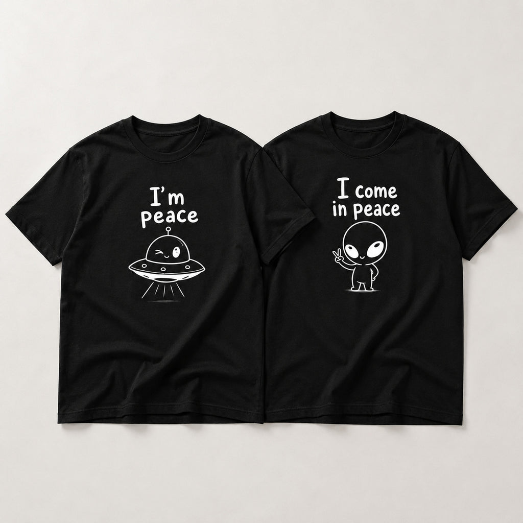 I Come In Peace matching couple alien graphic tee black front flat lay