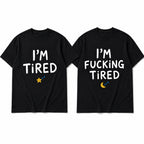 I'm Tired and I'm Fucking Tired matching couple black graphic tees front flat lay
