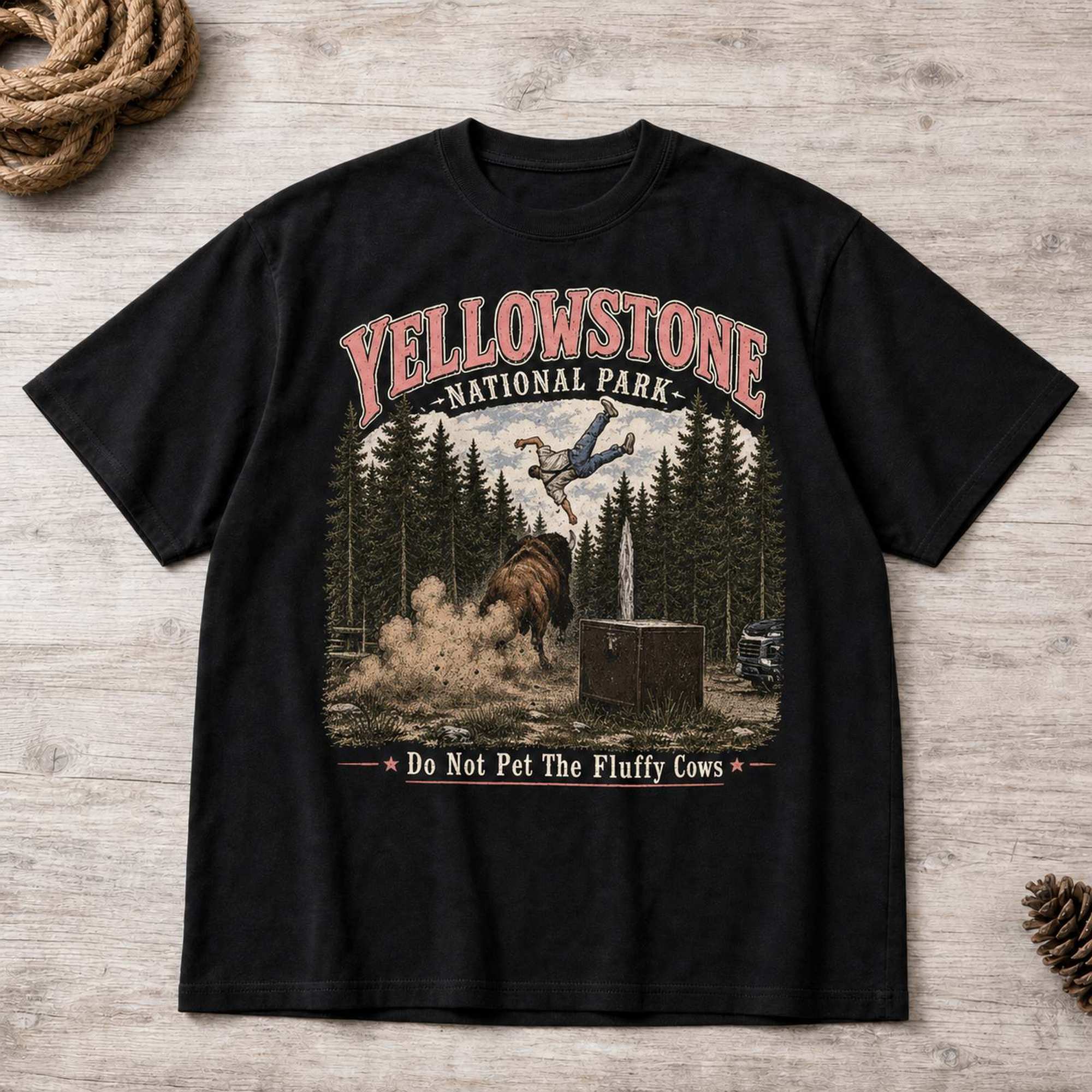Yellowstone bison national park graphic tee black front flat lay with rope and pinecone