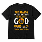 God protected me young and stupid rooster graphic tee black front flat lay