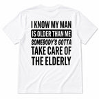 White I Know My Man Is Older Than Me graphic tee, full back flat-lay with black slogan