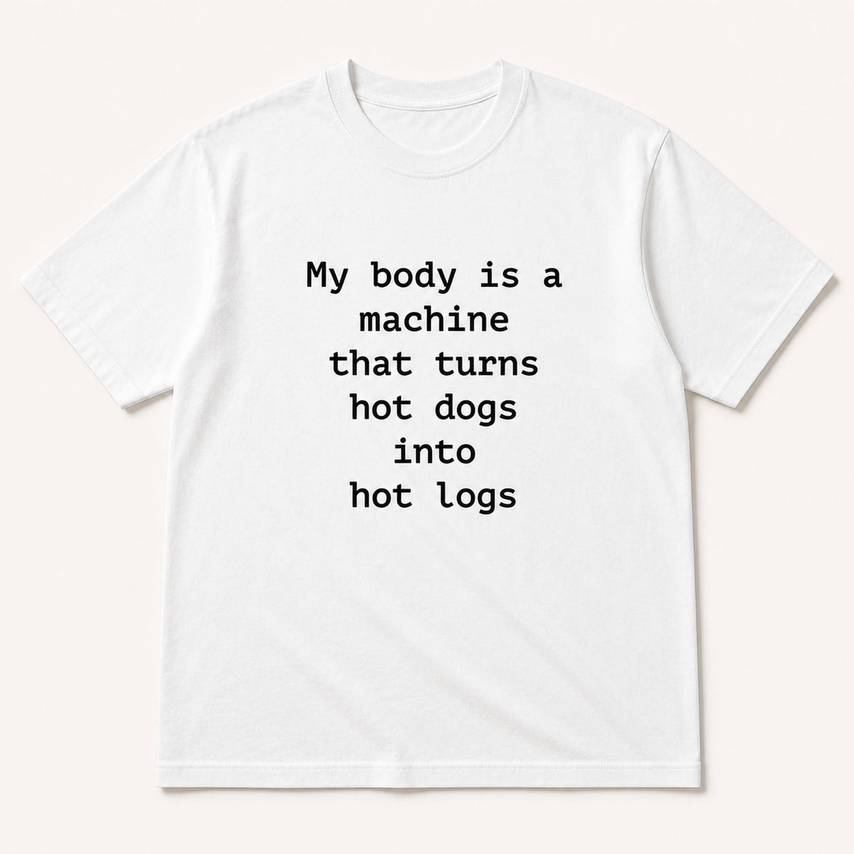 My body is a machine that turns hot dogs into hot logs white funny graphic tee, front flat-lay view