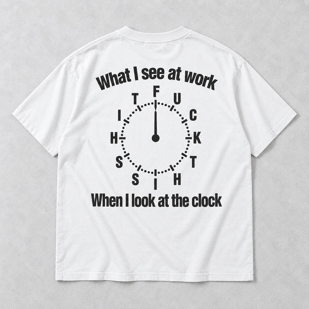 White graphic tee back flat lay with What I See At Work lettering design
