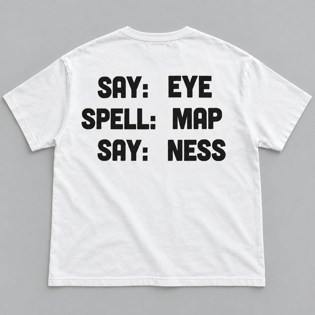 Say Eye Spell Map Say Ness black lettering on a white T-shirt back flat lay against a grey background