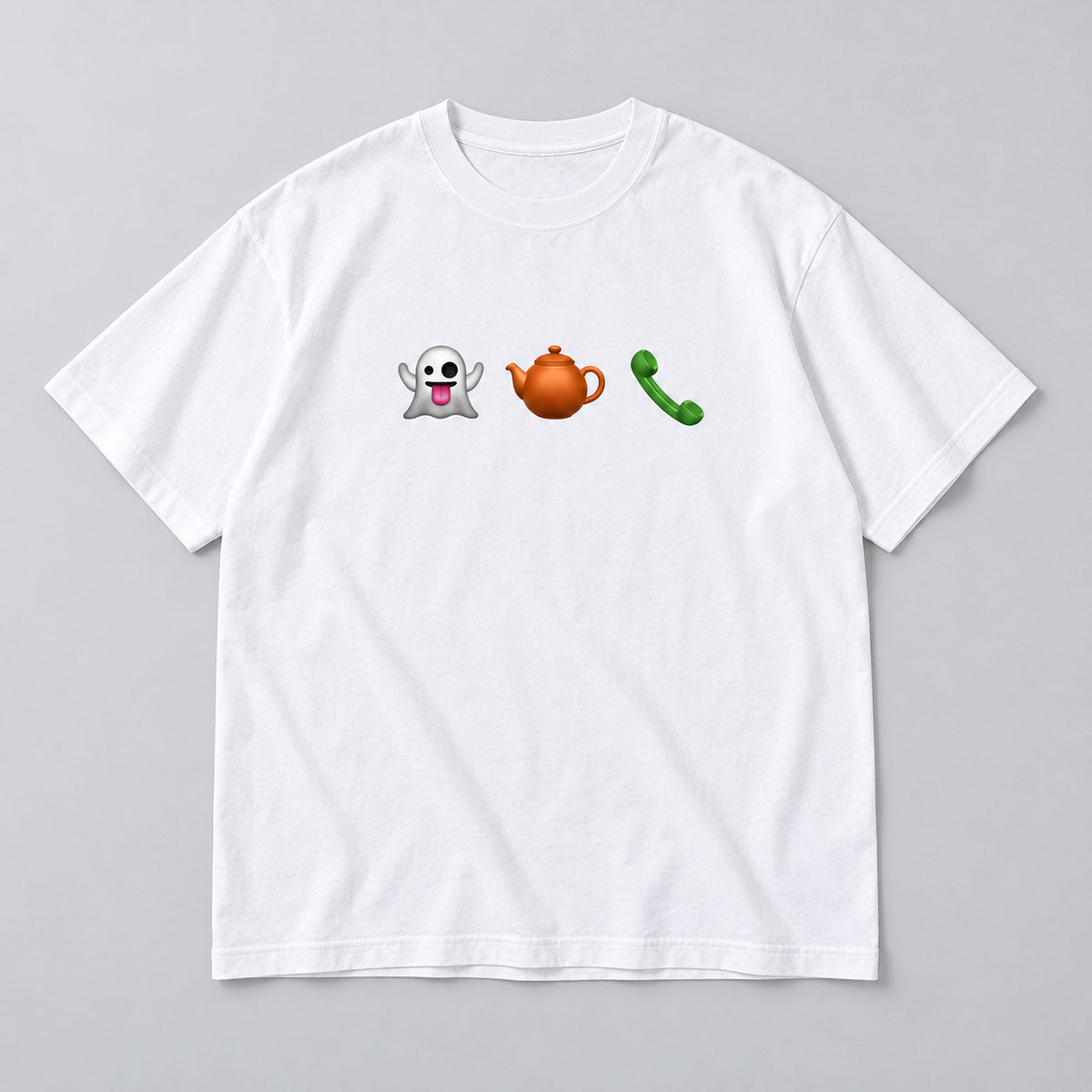 White tee front flat lay showing three chest icons: ghost, orange teapot and green phone