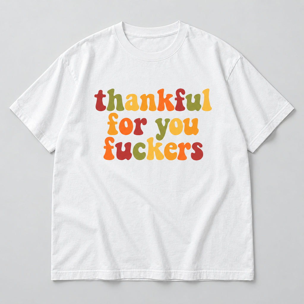 White tee front flat lay with colorful retro Thankful For You Fuckers lettering
