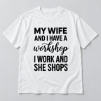 White graphic tee front flat lay with My Wife And I Have A Workshop design