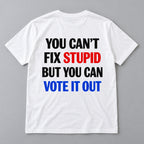 You Cant Fix Stupid But You Can Vote It Out red white blue slogan graphic on white T-shirt back, flat lay showing complete print