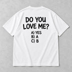 White graphic tee back flat lay with Do You Love Me design