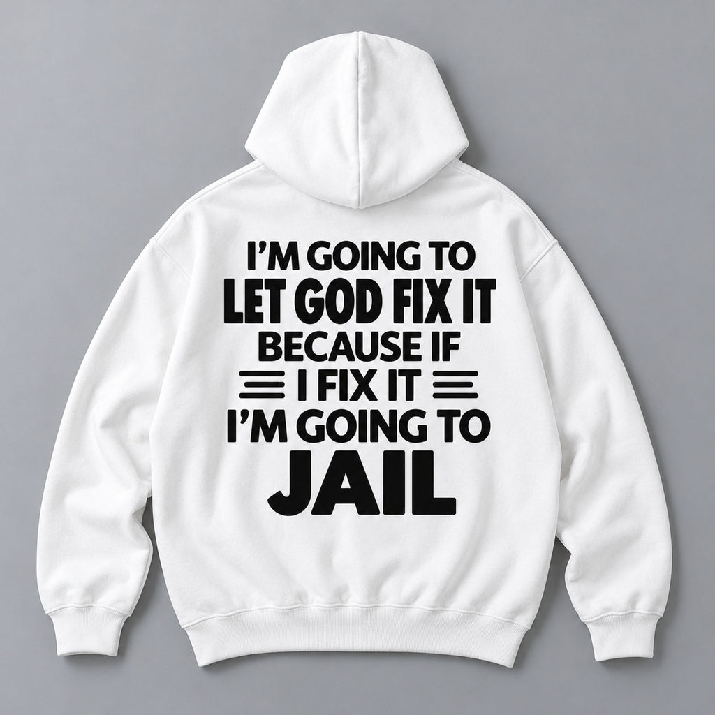 Let God Fix It because if I fix it I am going to jail slogan on white hoodie back, flat lay showing complete print