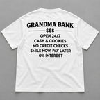 White graphic tee back flat lay with Grandma Bank lettering design