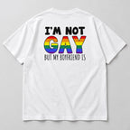 I'm Not Gay But My Boyfriend Is white tee flat lay, rear view showing the black text and rainbow slogan