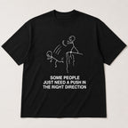 Some People Need A Push funny graphic tee black front flat lay
