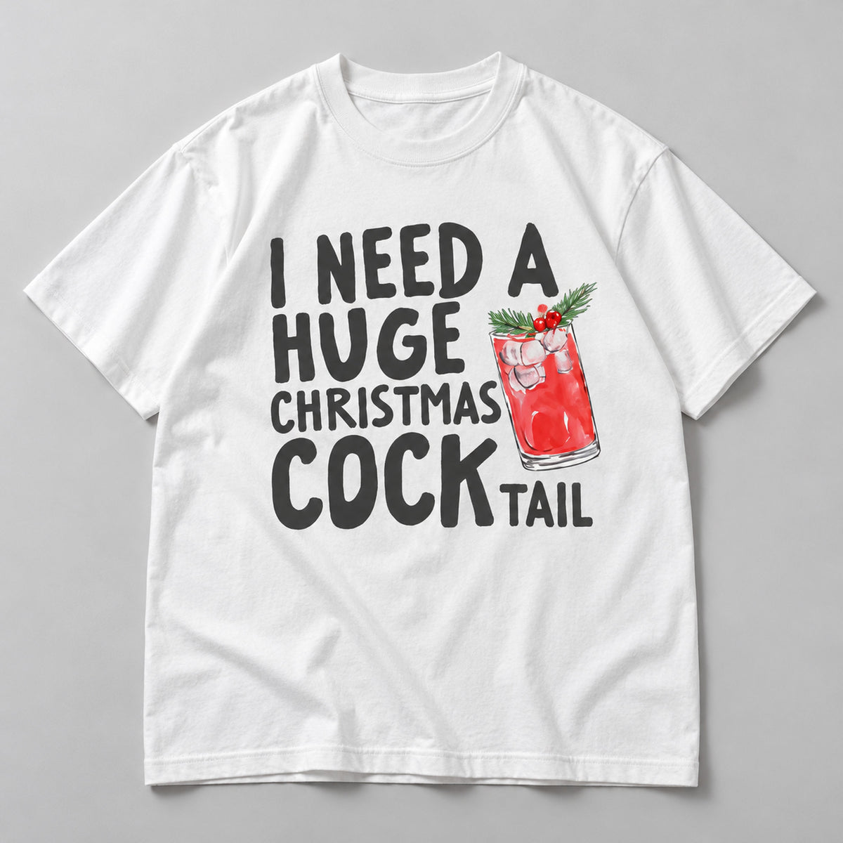 I Need a Huge Christmas Cocktail drink graphic on white T-shirt front, flat lay