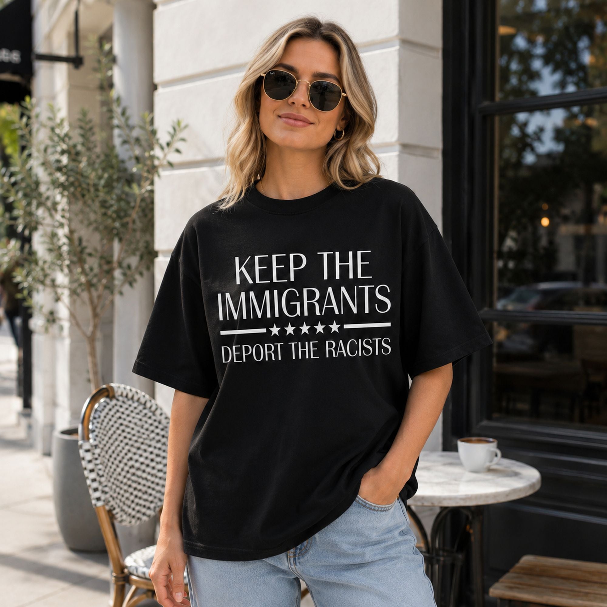 Keep The Immigrants Deport The Racists Statement Graphic Tee front print product photo 02 | Diya Glow