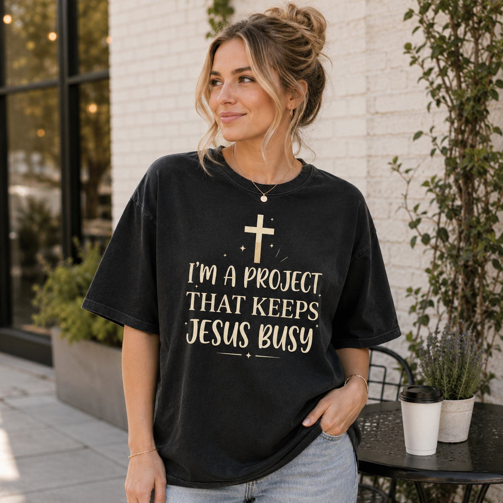 I'm A Project That Keeps Jesus Busy Faith Graphic Tee front print product photo 03 | Diya Glow