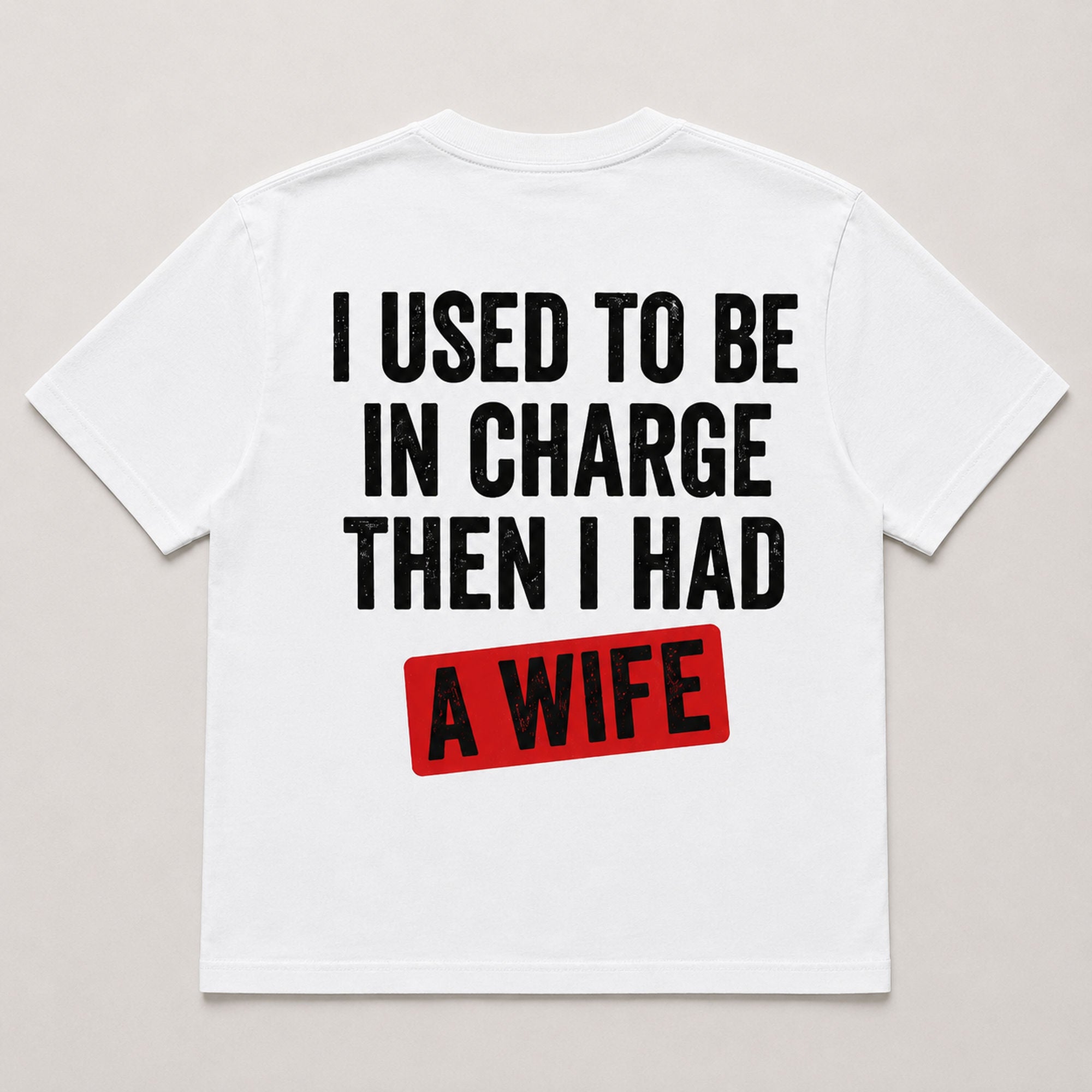 I Used To Be In Charge Then I Had A Wife funny graphic tee white back flat lay