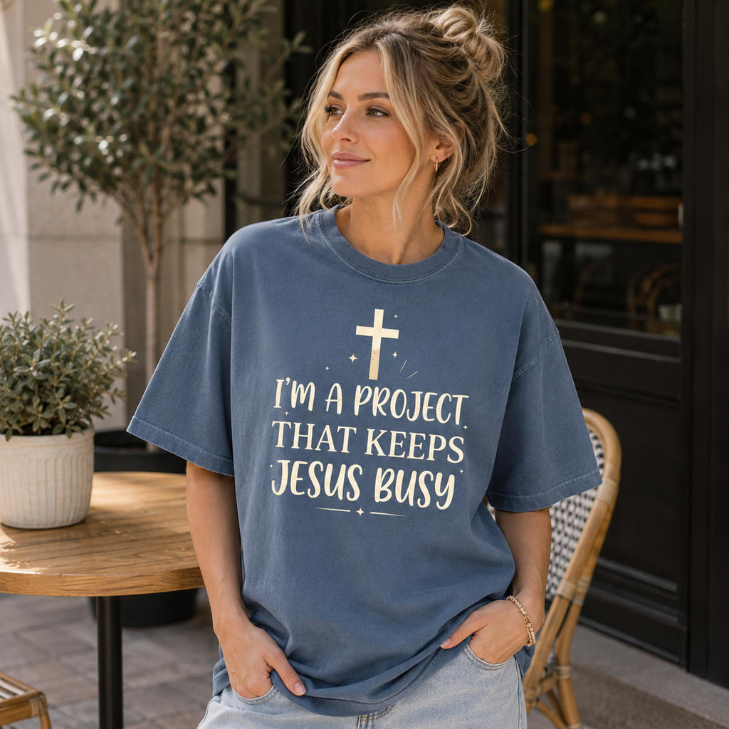 I'm A Project That Keeps Jesus Busy Faith Graphic Tee front print product photo 05 | Diya Glow