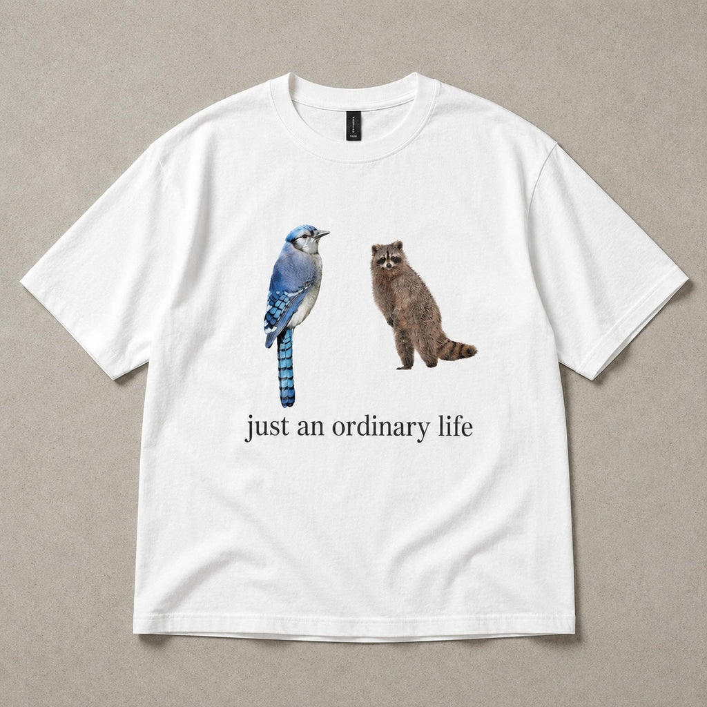 Just An Ordinary Life Blue Jay Raccoon Funny Graphic Tee front print product photo 06 | Diya Glow