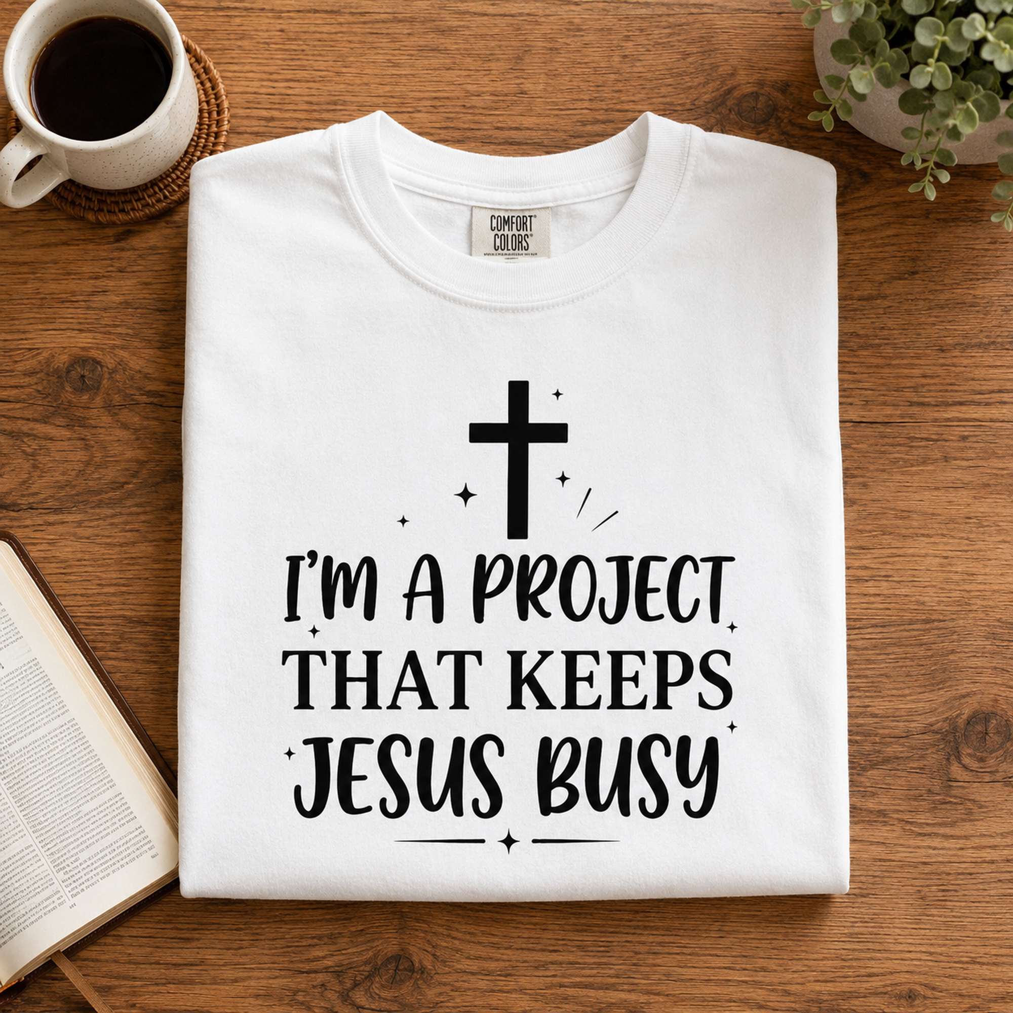 I'm A Project That Keeps Jesus Busy Faith Graphic Tee front print product photo 07 | Diya Glow