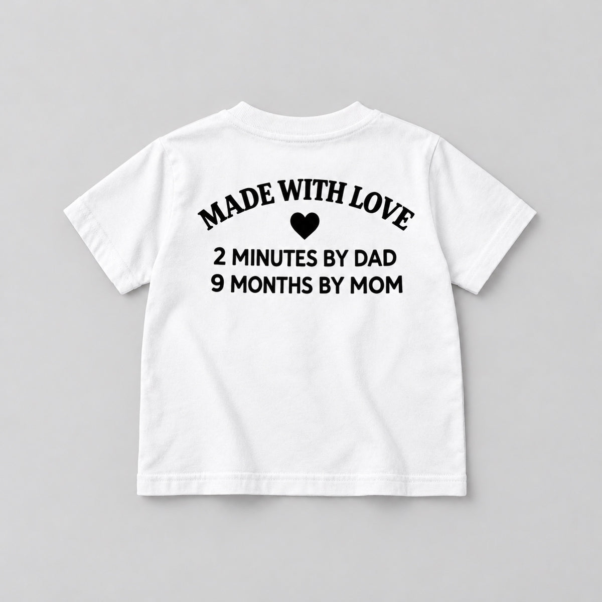 Made With Love white children’s T-shirt back flat lay showing black heart and family slogan