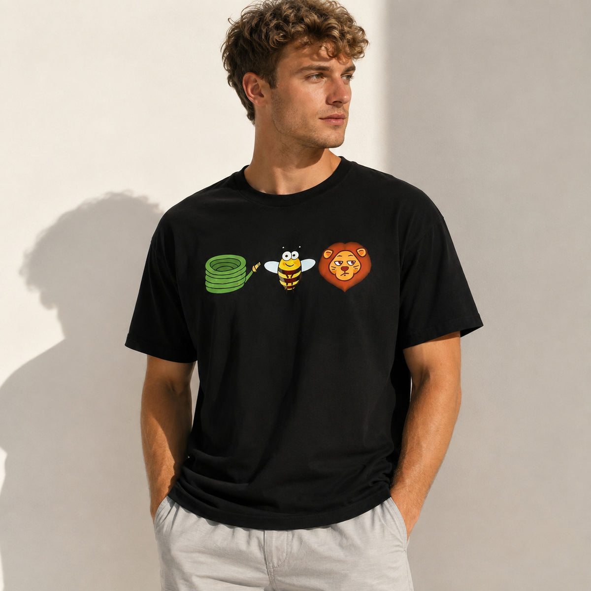 Black Hose Bee Lion rebus graphic tee on male model in sunlit neutral studio