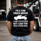 Tow truck driver Can't Fix Stupid graphic tee in black, back-print male model beside a tow truck