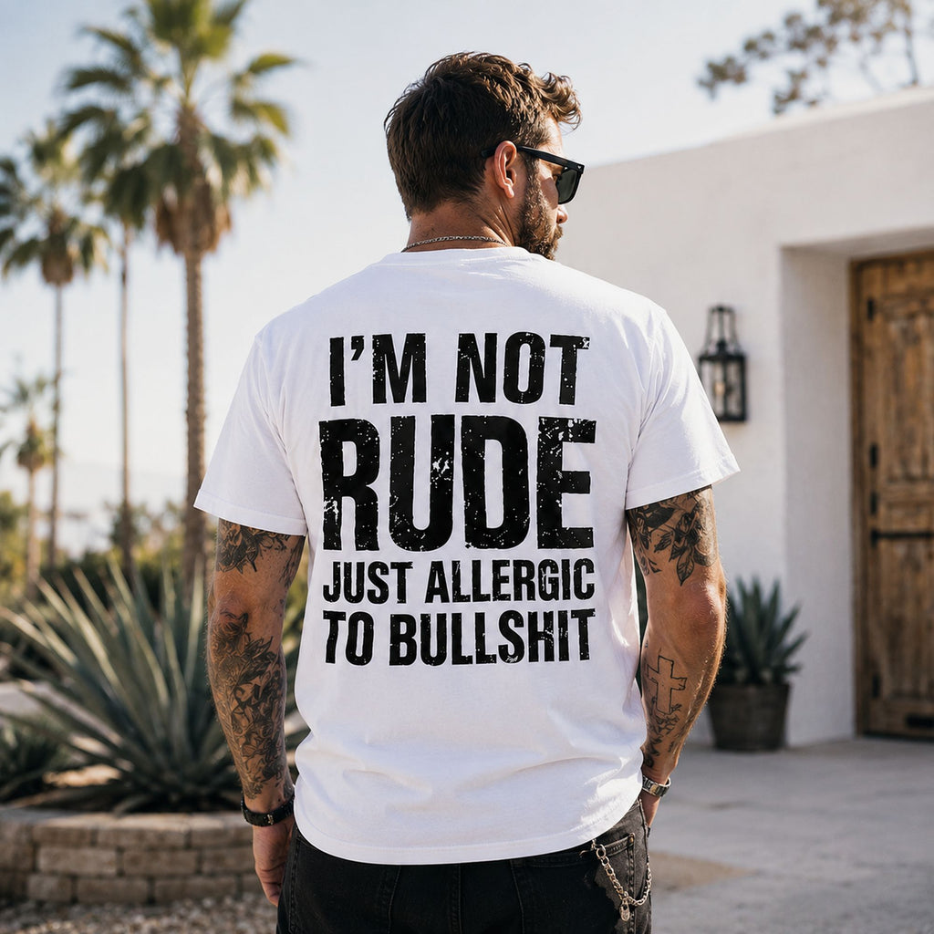 Man wearing white I'm Not Rude Just Allergic to Bullshit funny back-print graphic tee outdoors