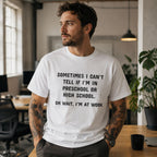 White funny work graphic tee with black preschool-or-high-school slogan on male model in office