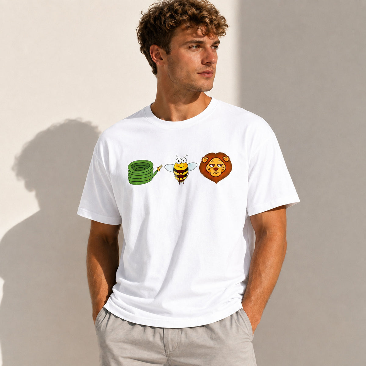 White Hose Bee Lion rebus graphic tee on male model in sunlit neutral studio