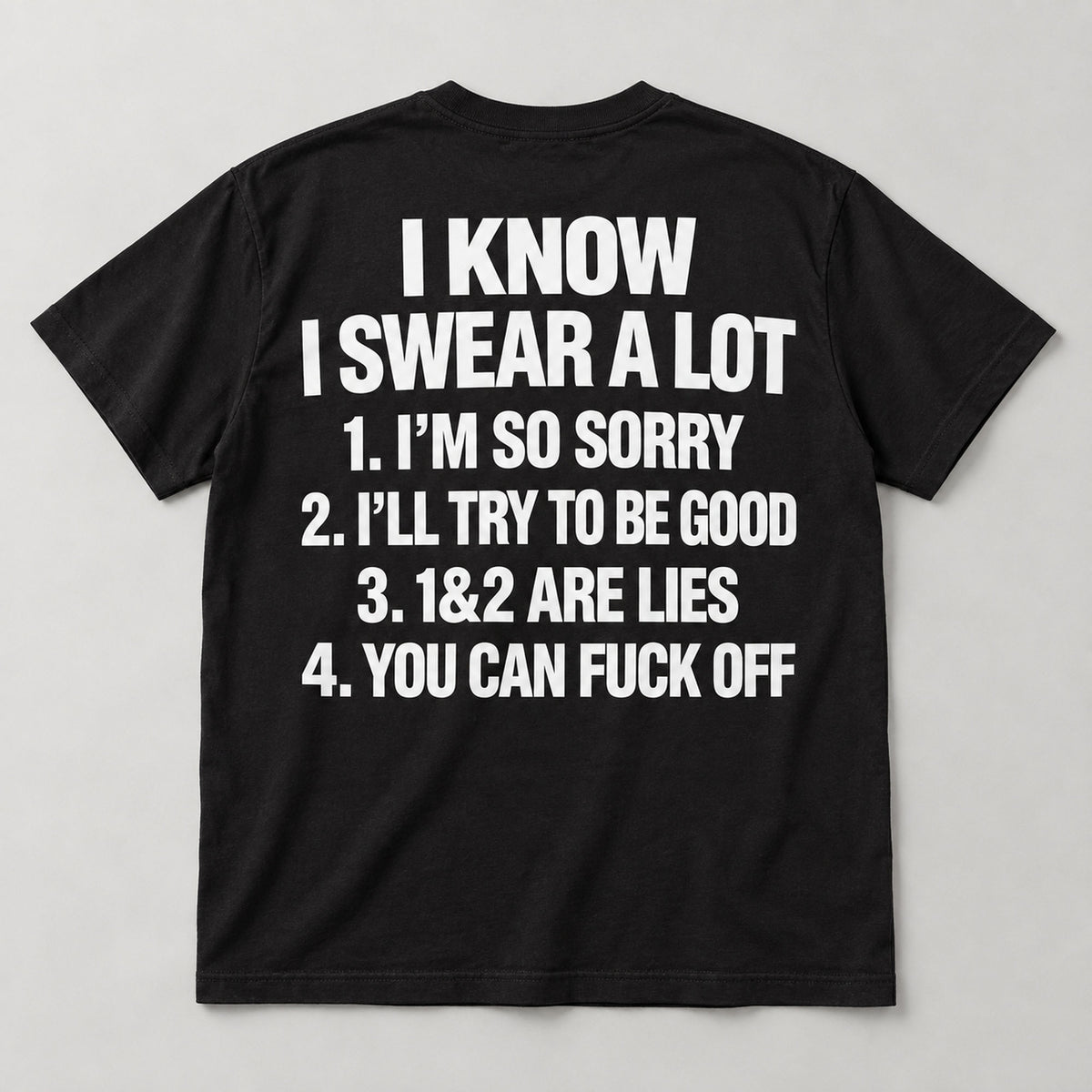 Black I Know I Swear A Lot back-print T-shirt laid flat, showing white bold lettering and four numbered lines