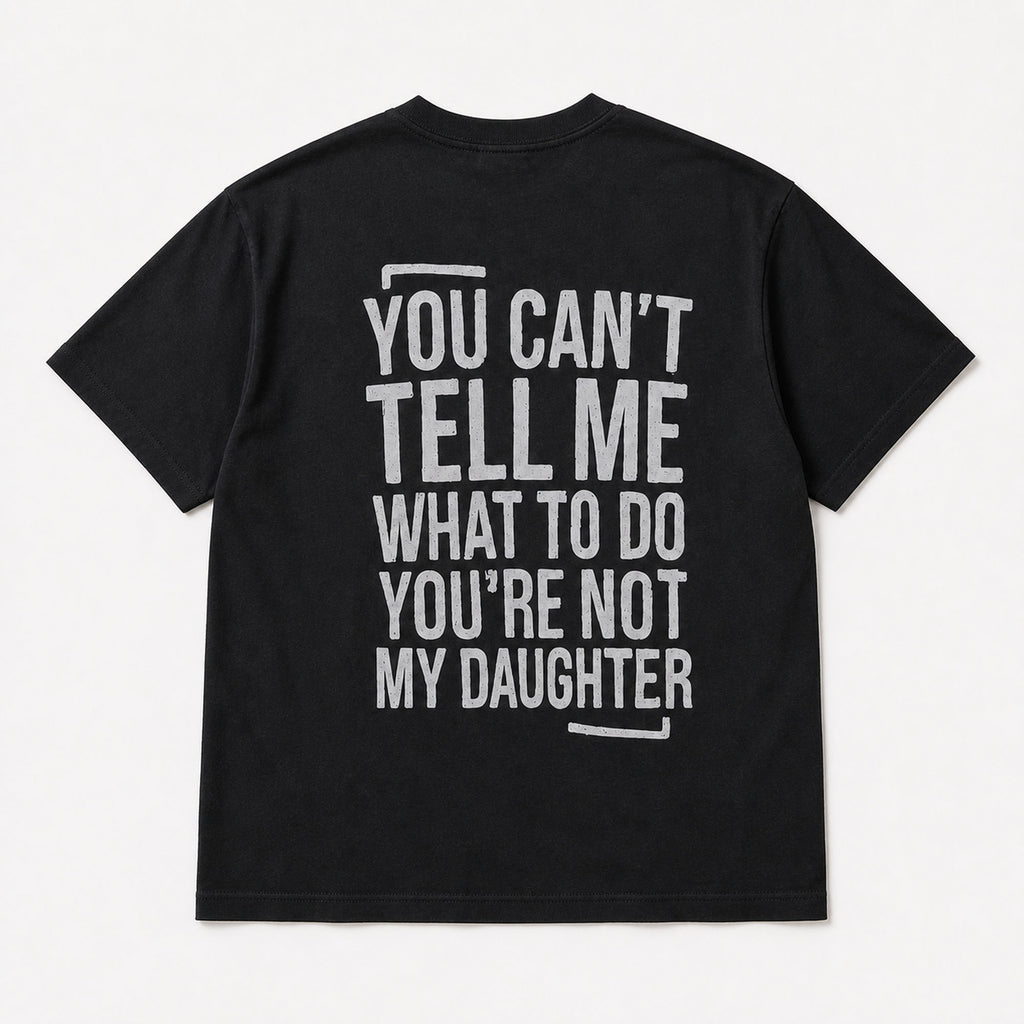You Can't Tell Me What to Do funny dad graphic black T-shirt back flat lay