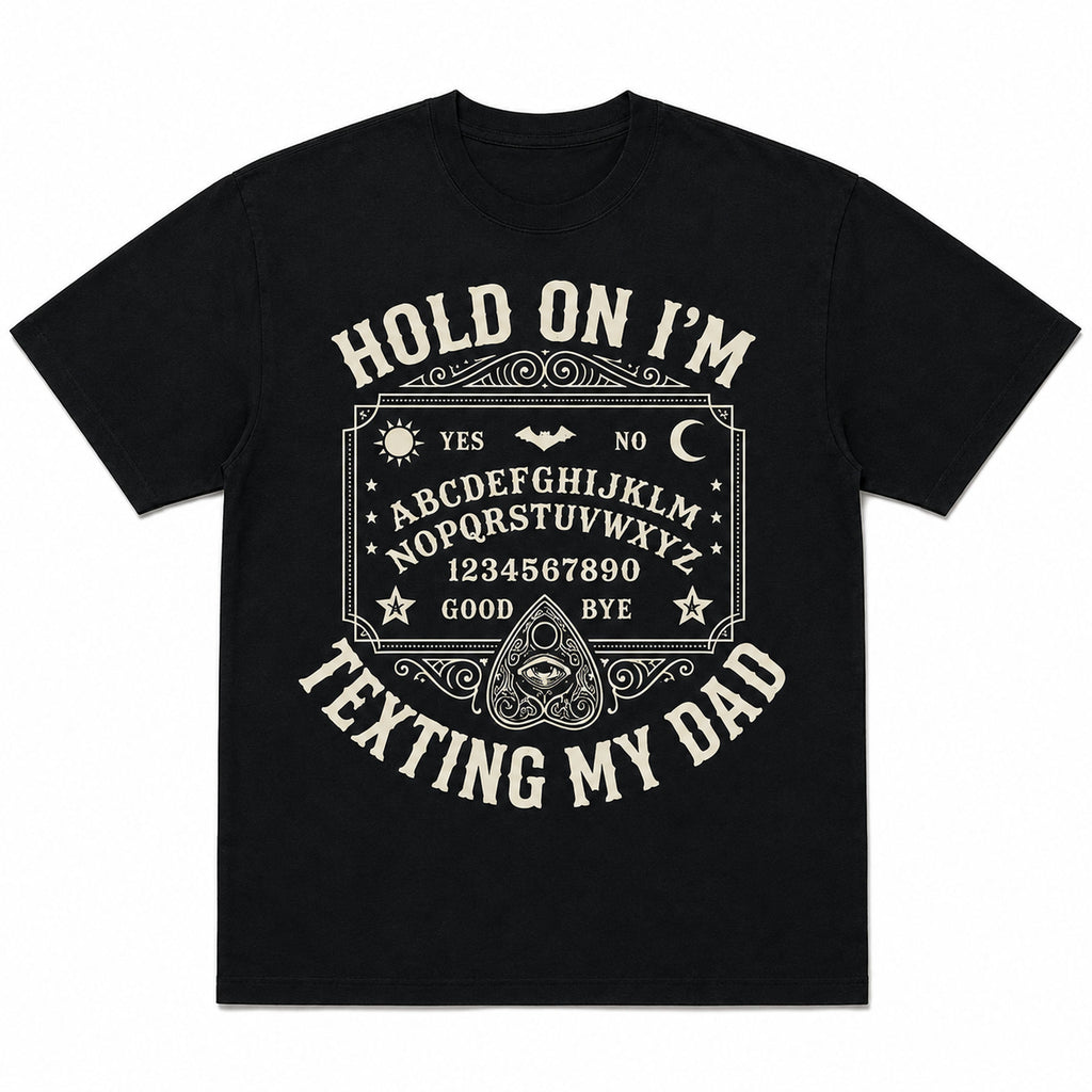 Black Hold On I'm Texting My Dad Ouija board graphic tee, front flat lay