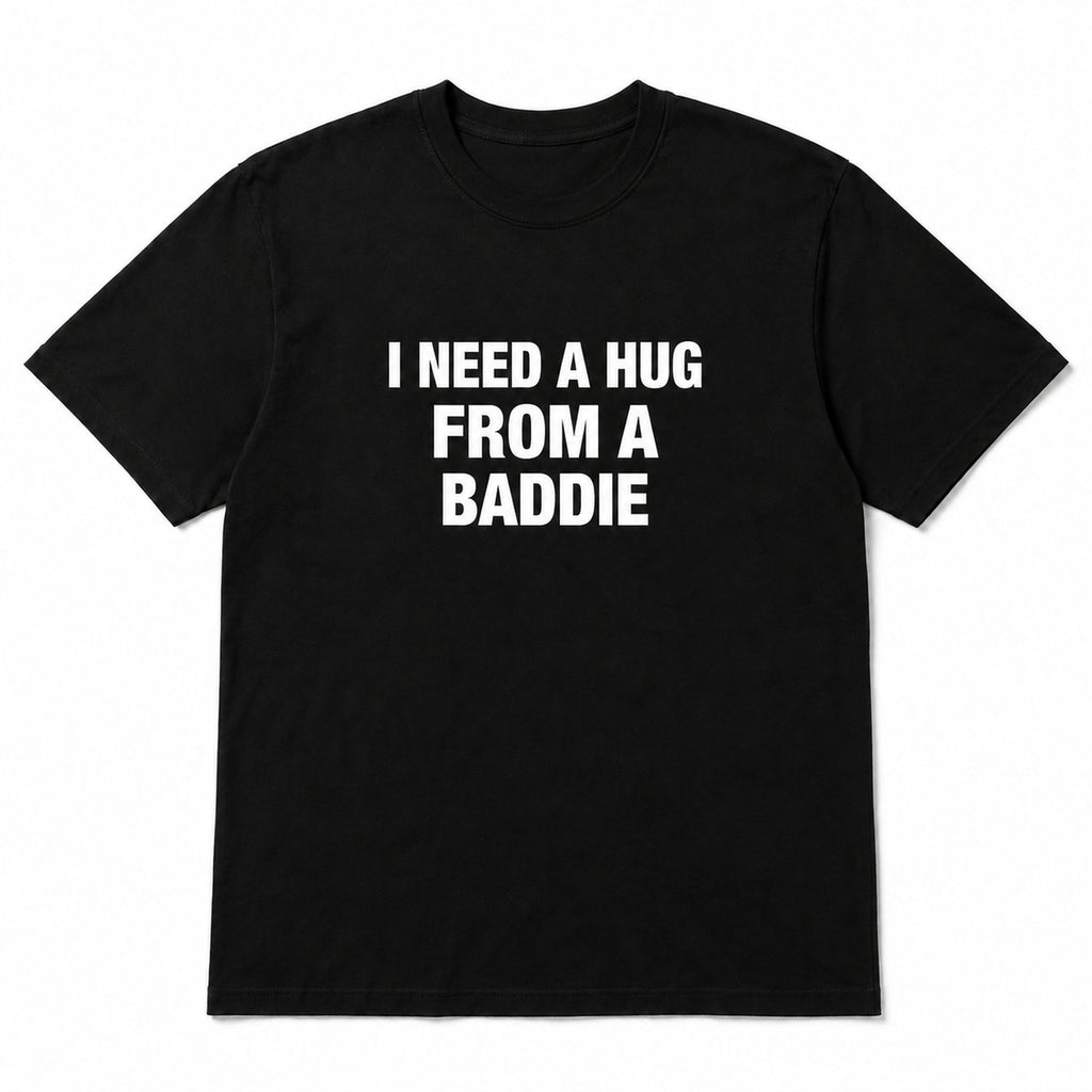 Black I Need a Hug From a Baddie funny front-print graphic tee, front flat lay on white background