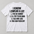 White I Know I Swear A Lot funny graphic T-shirt back flat lay with black lettering on a light grey background