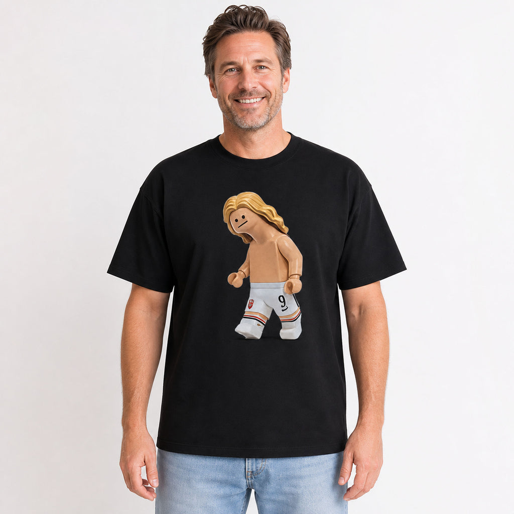 Blond number nine toy striker graphic on black T-shirt worn by a 40-year-old male lifestyle model